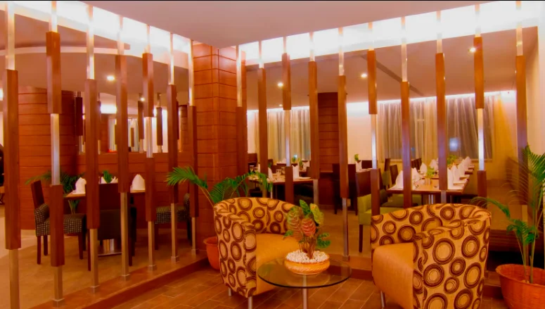 Elegant vegetarian dining setup at hotel restaurant with Indian cuisine.