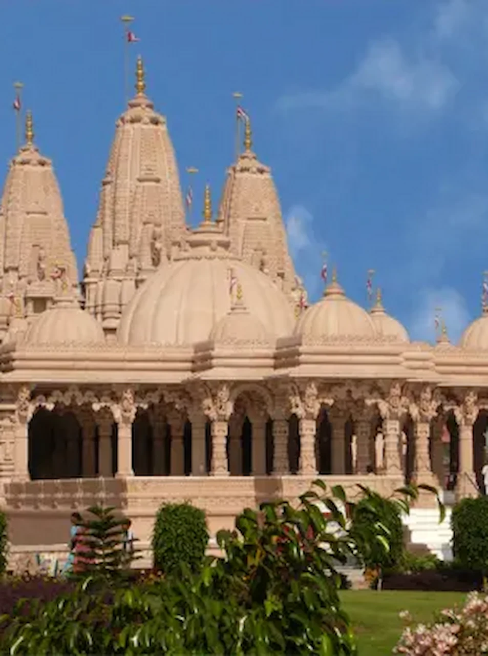 BAPS Shri Swaminarayan Mandir in Bhavnagar, a beautifully maintained spiritual landmark located near IRA by Orchid Bhavnagar.